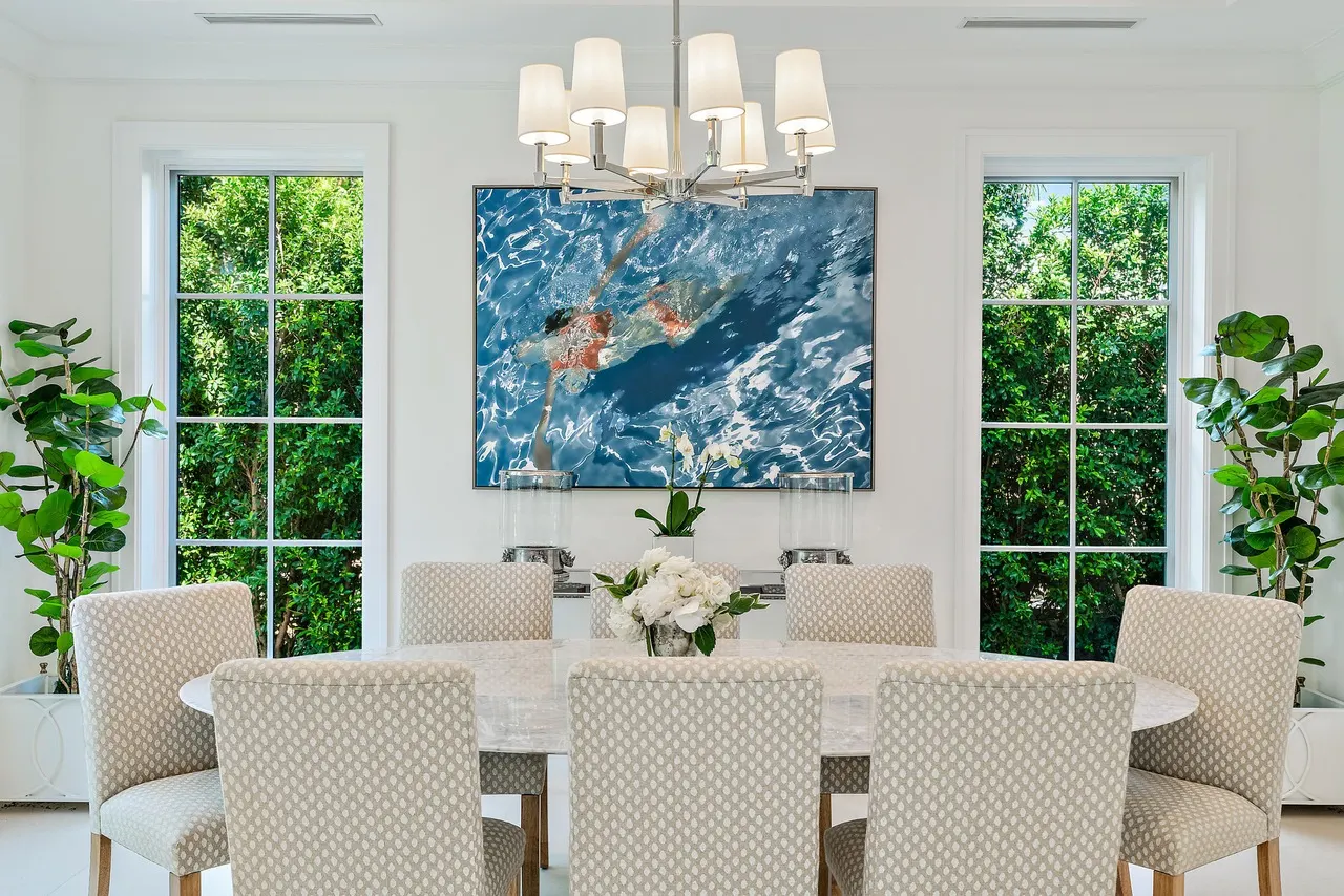 1585 N Lake Way dining room with marble table and chandelier